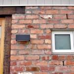 Reclaimed timber door frames and lintel, and recycled exterior brickwork.