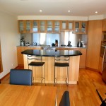 The renovated kitchen, featuring timber kitchen units