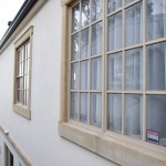 Windows also framed in local sandstone