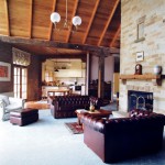 Sandstone fireplace and timber ceiling