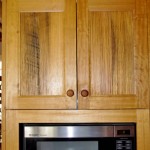 The kitchen cabinets were made from discarded fence palings.