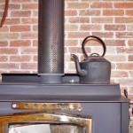 A wood stove augments winter heating.